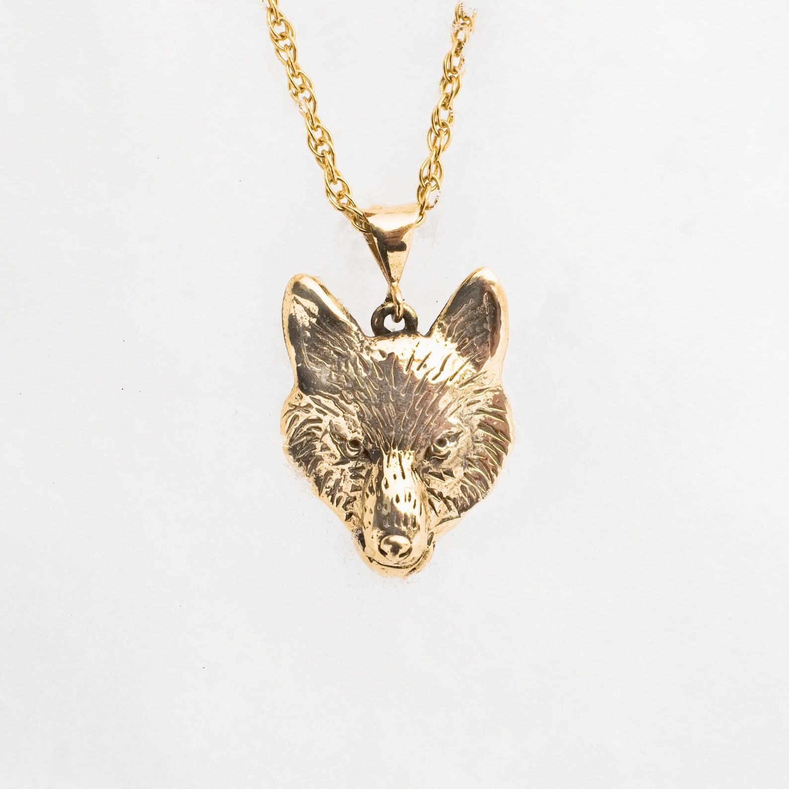 solid gold wolf pendant