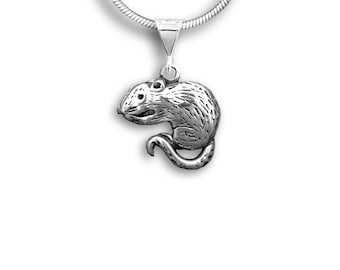 May include: A silver-colored pendant necklace featuring a detailed mouse charm. The mouse charm is sculpted with textured fur and a curled tail, suspended from a silver chain. The pendant is approximately 1 inch in length.