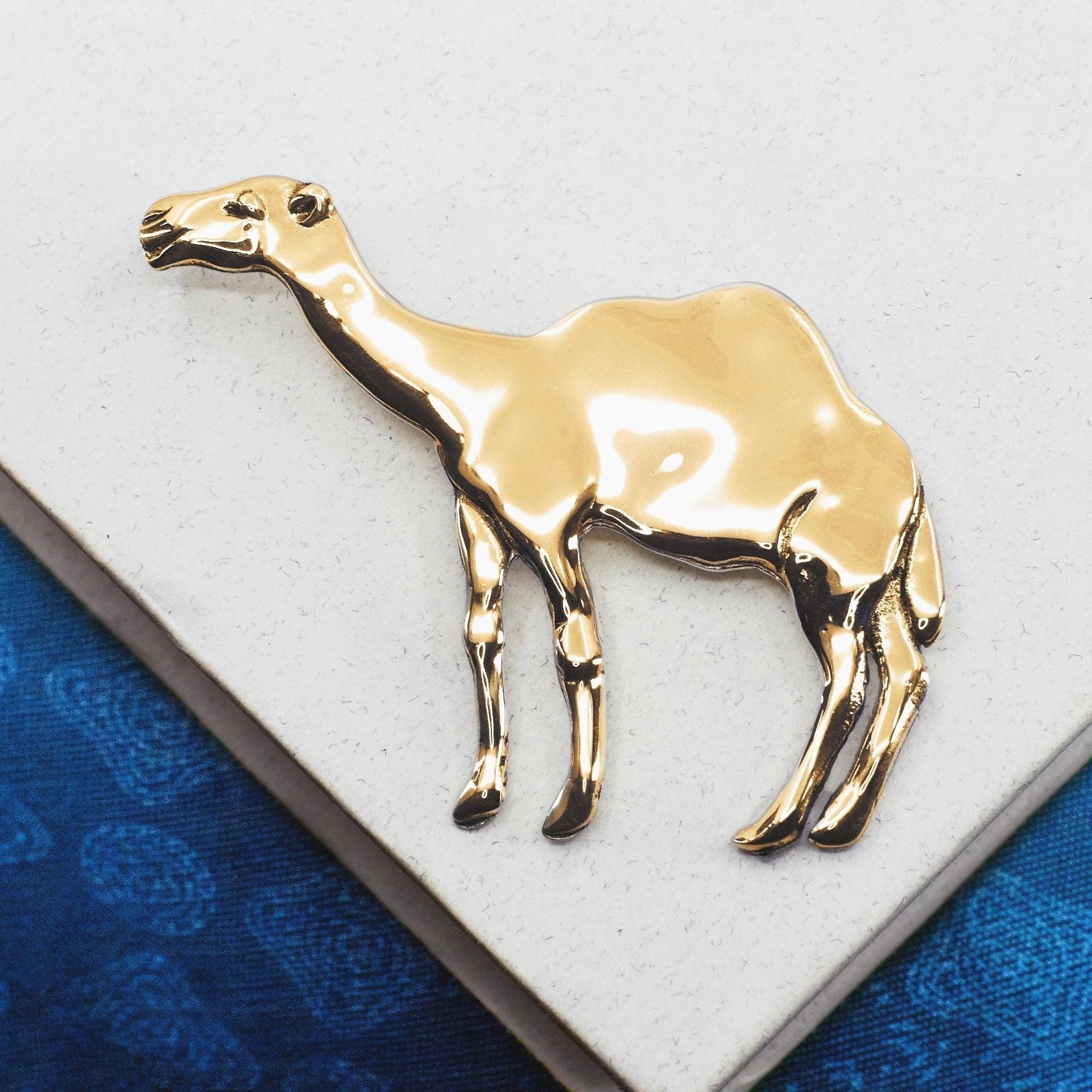 Gold store camel pendant