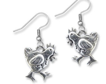 May include: A pair of silver chicken dangle earrings. Each earring features a detailed, stylized chicken design with a textured finish.
