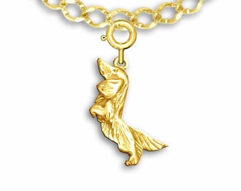 May include: A gold chain necklace with a charm of a dachshund dog standing on its hind legs.