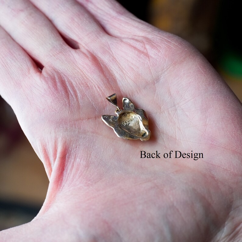 solid gold wolf pendant