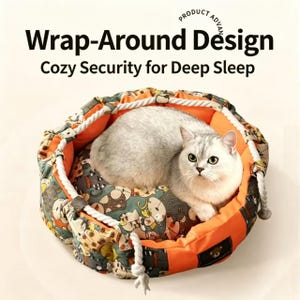 May include: A round pet bed with a white rope drawstring, featuring a gray and orange cat-patterned fabric exterior and a solid orange interior. A light gray cat sits inside. Text reads: Wrap-Around Design, Cozy Security for Deep Sleep.