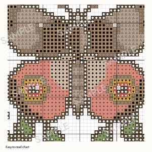 May include: A cross-stitch pattern chart featuring a symmetrical butterfly design. The upper wings are brown with geometric symbols, while the lower wings are pink with yellow and red accents. The grid includes the word SAMPLE in light gray.