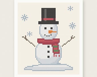 May include: A cross-stitch pattern featuring a snowman wearing a black top hat with a red band and a red and green striped scarf. The snowman has an orange carrot nose, black eyes, and mouth, with brown stick arms and blue snowflakes.