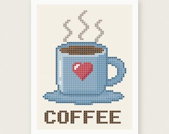 May include: A cross-stitch pattern featuring a light blue coffee mug with a red heart, brown coffee, and grey steam. The word COFFEE is stitched in brown below the mug. The design is set against a cream-colored grid background with a white border.