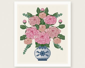 May include: A cross stitch pattern featuring a bouquet of pink and peach roses with green leaves in a blue and white patterned vase. The design includes the text PDF PATTERN - INSTANT DOWNLOAD at the top and HOUSE OF NEEDELIER at the bottom.