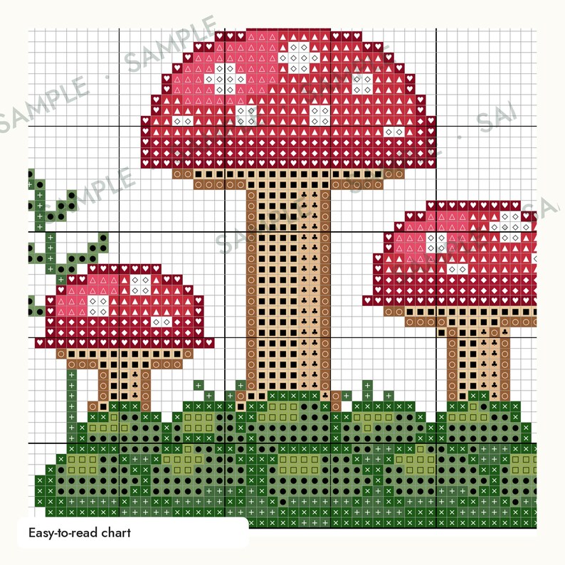 May include: A cross-stitch pattern chart featuring three red mushrooms with white spots on a green grassy base. The design uses a grid with various symbols like hearts, diamonds, triangles, and plus signs to indicate thread colors. The text "SAMPLE" appears across the image.