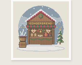 May include: A cross stitch pattern featuring a brown gingerbread stall with the text GINGERBREAD above a counter displaying cookies and gifts. A green Christmas tree stands to the right, and a brown stove with white steam sits to the left.