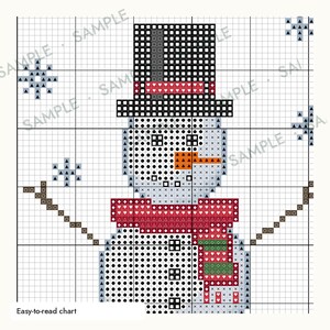 May include: A cross-stitch pattern chart featuring a snowman wearing a black top hat with a red band and a red and green scarf. The design includes brown stick arms and blue snowflakes on a grid background with the text Easy-to-read chart.