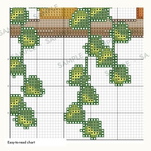 May include: A cross stitch pattern chart featuring hanging green vines with leaves depicted by various symbols including triangles, hearts, and crosses on a white grid. The design includes a horizontal brown branch element at the top with text reading Easy-to-read chart.