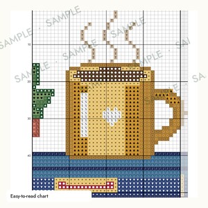 May include: A cross-stitch pattern chart featuring a tan coffee mug with a handle, steam rising from the top, and a small green plant to the left. The design is set against a dark blue background with a grid overlay and the text Easy-to-read chart.