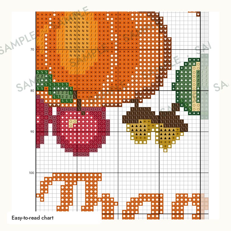 May include: A cross-stitch pattern chart featuring a large orange pumpkin, a red apple, green leaves, and two brown acorns. The grid-based design includes symbols for color placement and the partial orange text "Than" at the bottom of the page.