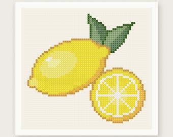 May include: A cross stitch pattern featuring a bright yellow lemon with two green leaves and a sliced lemon round showing internal segments. The design is set against a light cream background with the text PDF PATTERN INSTANT DOWNLOAD and HOUSE OF NEEDELIER CROSS STITCH PATTERNS.