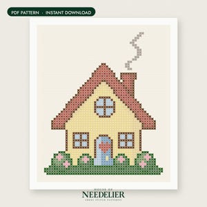 May include: A cross stitch pattern featuring a yellow house with a red roof, a blue door with a red heart, and green bushes with pink flowers. Smoke rises from the chimney. The text reads PDF PATTERN INSTANT DOWNLOAD and HOUSE OF NEEDELIER.