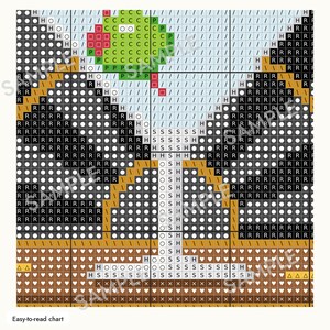 May include: A cross-stitch pattern chart featuring a martini glass with a green olive on a toothpick. The grid displays symbols and letters including H, O, P, R, S, and C against a light blue background, with dark areas and brown sections.