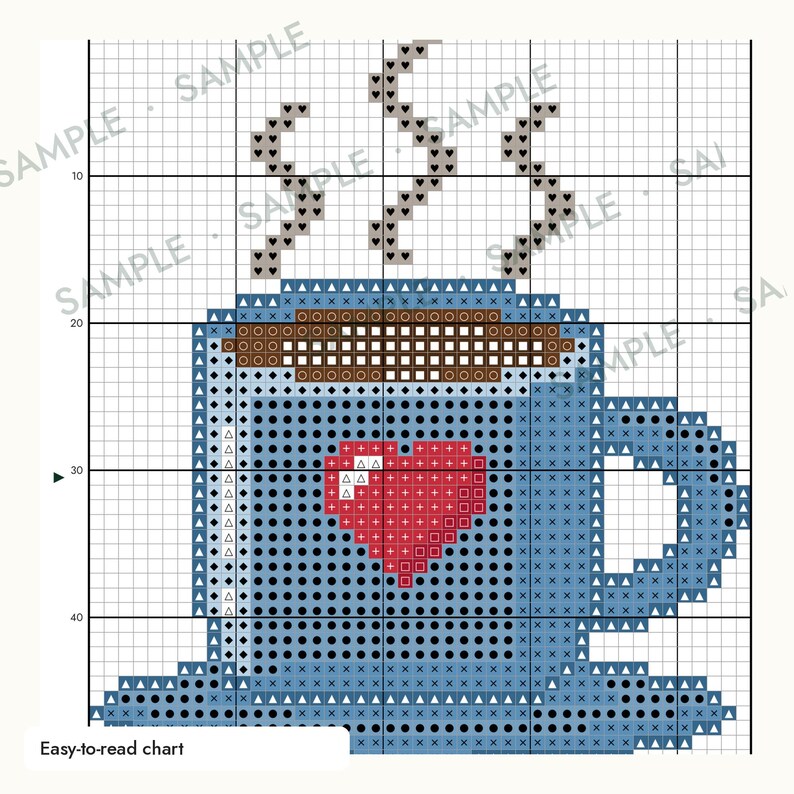 May include: A cross-stitch pattern chart featuring a blue mug with a red heart design on the front. The mug contains a brown beverage with gray steam rising from the top. The grid includes the word SAMPLE repeated across the background.