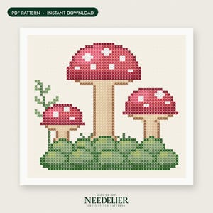 May include: A cross stitch pattern featuring three red mushrooms with white spots on a green mossy base, with a small green vine on the left. The design includes the text PDF PATTERN INSTANT DOWNLOAD and HOUSE OF NEEDELIER CROSS STITCH PATTERNS.