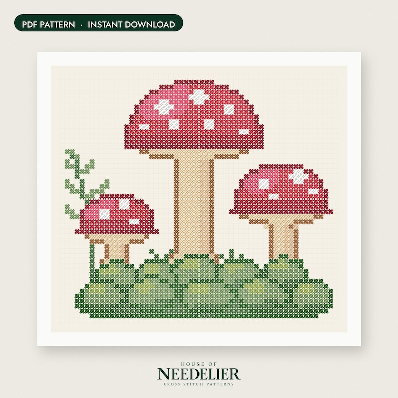 May include: A cross stitch pattern featuring three red mushrooms with white spots on a green mossy base, with a small green vine on the left. The design includes the text PDF PATTERN INSTANT DOWNLOAD and HOUSE OF NEEDELIER CROSS STITCH PATTERNS.
