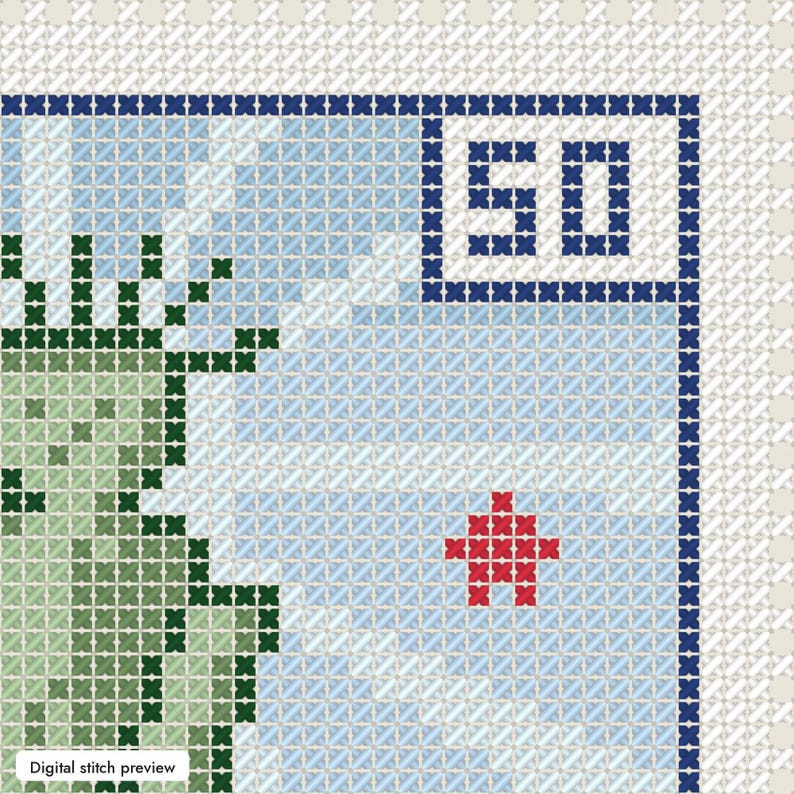 May include: A cross-stitch pattern on white Aida cloth featuring a light green figure on the left, a blue sky background, a red star, and the number 50 in a dark blue square frame. The design includes a dark blue border and a white edge.