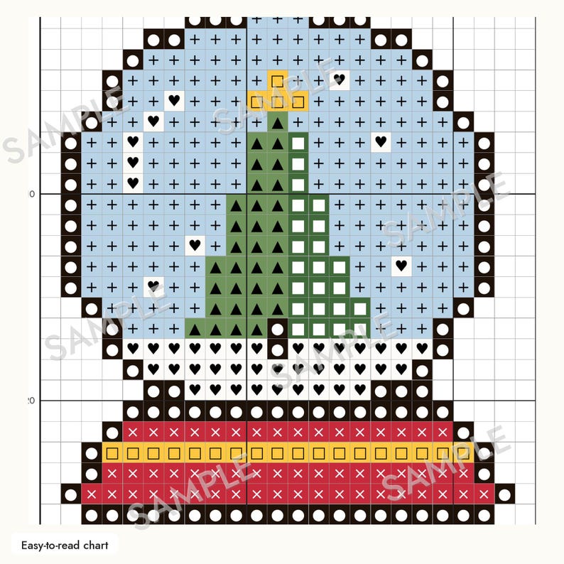 May include: A cross-stitch pattern chart featuring a snow globe design. The globe contains a green Christmas tree on a light blue background with black plus signs and heart symbols. The base is red with a yellow stripe and black symbols.