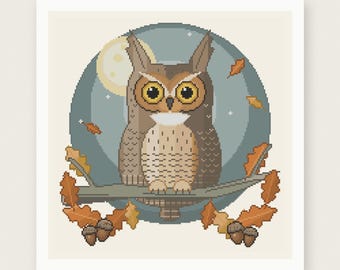 May include: A cross stitch pattern featuring a brown owl with large yellow eyes perched on a branch against a circular blue background with a moon and falling orange oak leaves. The text reads PDF PATTERN INSTANT DOWNLOAD and HOUSE OF NEEDELIER.