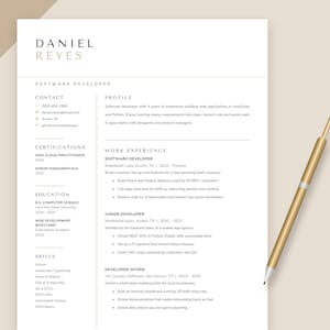 May include: A professional resume template for a software developer named Daniel Reyes, featuring a clean layout with sections for contact, profile, work experience, certifications, education, and skills, accompanied by a gold-toned pen.