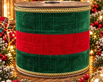 May include: A wide spool of ribbon featuring a textured dark green fabric with a solid red horizontal stripe running through the center. The top and bottom edges of the ribbon are finished with a decorative gold twisted rope trim.