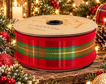 May include: A spool of red fabric ribbon featuring a plaid pattern with green, gold, and thin metallic stripes. The cardboard top is printed with the text a. sievens fine ribbons and d. stevens llc, featuring a gold reindeer graphic.