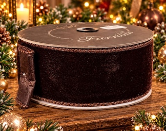 May include: A spool of dark brown velvet ribbon with a metallic copper-colored braided edge. The top of the spool features the brand name Farrillo printed in white script. The ribbon is wrapped tightly around a circular cardboard core.
