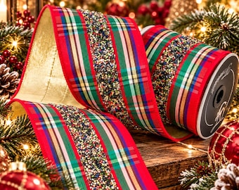 May include: A wide decorative ribbon featuring a red, green, and gold plaid pattern with a central strip of multicolored metallic beads. The ribbon has a solid gold-colored underside and is wound onto a black circular spool with white text.