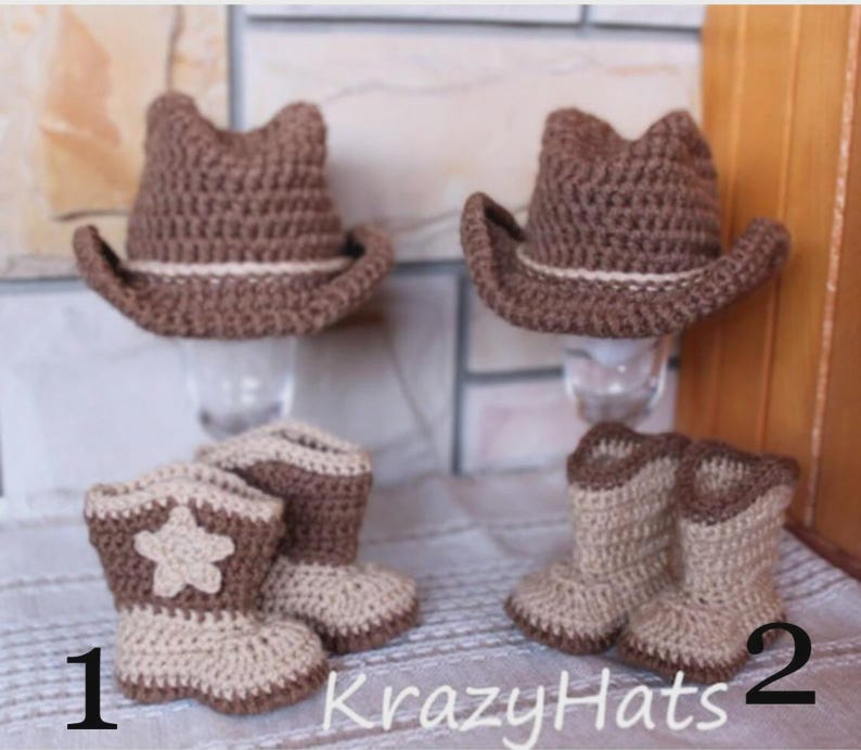 May include: Two crochet cowboy hats and two pairs of crochet cowboy boots in shades of brown and tan. One pair of boots has a star design. The hats have a light-colored band. The text "KrazyHats" is visible.