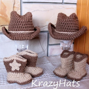 May include: Crocheted cowboy hats and boots in brown and beige. The hats have a light-colored band, and the boots feature a star design. The text "KrazyHats" is visible.