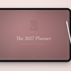 May include: A digital tablet displaying a mauve-colored planner interface titled The 2027 Planner. The screen features a line-art icon of a doorway, the text House of 22, and the phrase Plan with intention. Make your goals. Build what's yours. A stylus rests on the right side.
