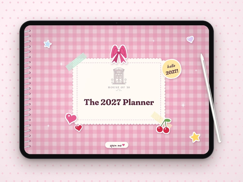 May include: A digital tablet displaying a pink gingham planner cover titled The 2027 Planner. The screen features a central cream-colored label with a House of 38 logo, a pink bow, cherry and heart stickers, a hello 2027 circle, and an open me button.