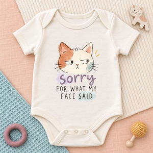 Sorry For What My Face Said Onesie®, Grumpy Calico Cat Baby Bodysuit