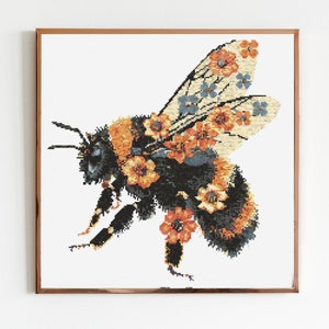 May include: A black and yellow bumblebee with orange and blue flowers on its wings and body. The bumblebee is in flight with its wings spread out.
