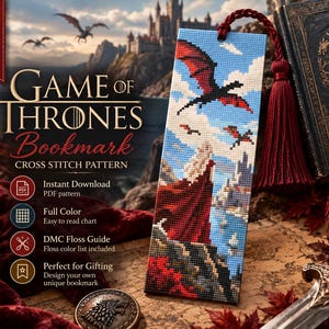 May include: A rectangular cross-stitch bookmark featuring a figure in a long red cloak standing on a cliff, looking toward a castle and two flying dragons in a blue sky. The bookmark has a deep red tassel attached to the top.