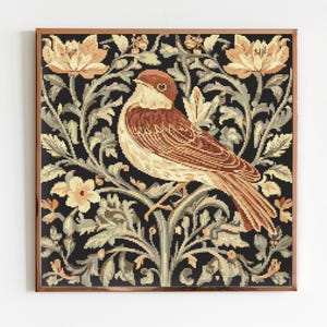 May include: A framed tapestry depicting a brown and white bird perched on a branch with green leaves and cream-colored flowers against a black background.