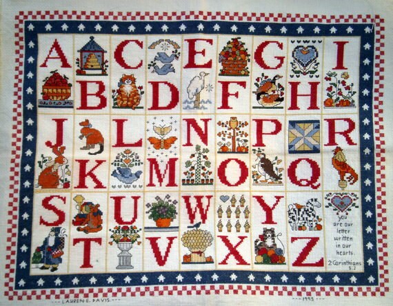 Items similar to Handmade cross stitch alphabet sampler ready to frame