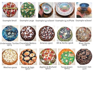 May include: A collection of 10 round fabric placemats with various designs, including underwater turtles, chocolate wafers, smores, oil and herbs, river rocks, mochas, bacon and eggs, apples and orchard, tacos green, and southwestern dark.