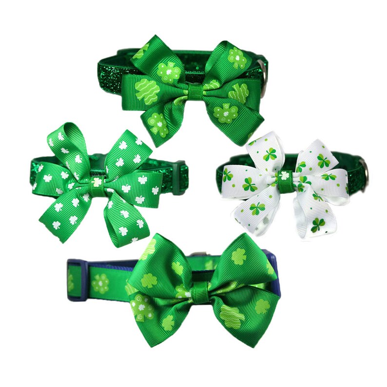 May include: Four different green and white dog collars with shamrock print and bow ties. The collars are decorated with green glitter and shamrock print.