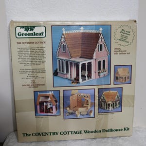 May include: The Coventry Cottage wooden dollhouse kit by Greenleaf. The box features a pink Victorian-style dollhouse with a brown roof and white trim. Includes shingles and furniture. Assembled size: 20.5" wide x 21" high x 10" deep.