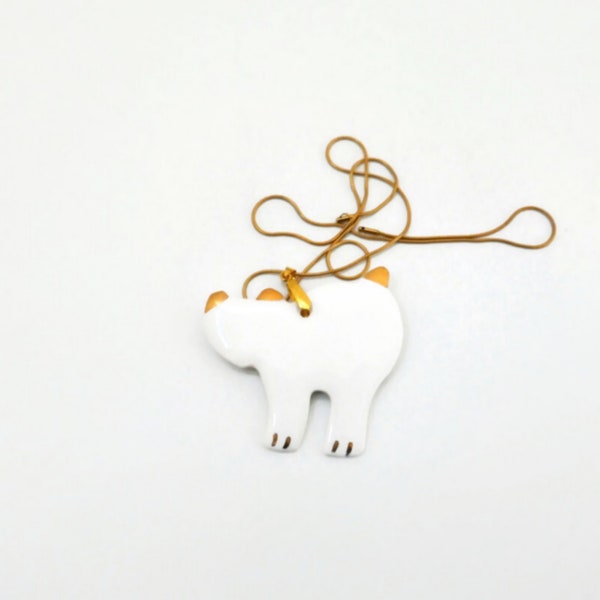 Bijou pendentif chat en porcelaine