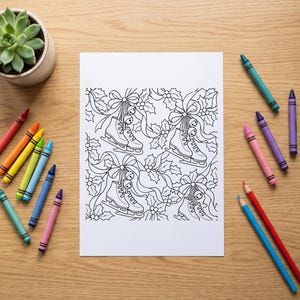 May include: A white colouring page featuring a repeating pattern of ice skates, holly leaves, berries, and bows with ribbons. The black and white line art is surrounded by several colourful wax crayons on a light wood surface.