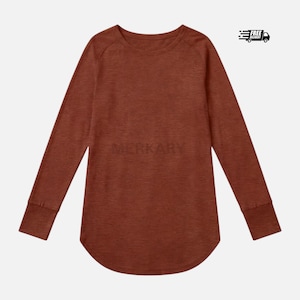 May include: A long-sleeve shirt in a solid, heathered rust-brown color. The garment features a round neckline, raglan sleeves, and a curved hemline. The word MERKARY is printed in a subtle, dark tone across the center of the chest area.
