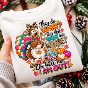 May include: A white sweatshirt featuring a cartoon turkey wearing a leopard print bow and slippers, holding a wooden spoon. The graphic includes text reading They do WHAT? They stuff WHAT into WHERE? Turkey Gravy Stuffing Oh hell no I AM OUT!