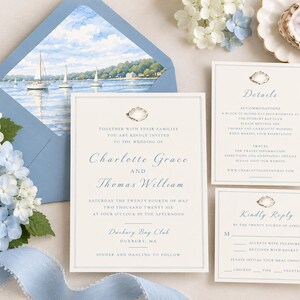 May include: A wedding invitation suite featuring cream-colored cards with blue text and an oyster shell icon. The envelope liner displays a coastal scene with sailboats on water. The text includes names Charlotte Grace and Thomas William.