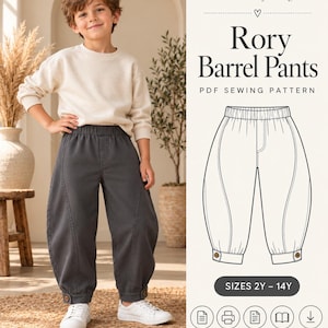 May include: A PDF sewing pattern for Rory Barrel Pants featuring a line drawing of elastic-waist trousers with curved side seams and buttoned cuffs. The text includes SewTheoryDesign, Rory Barrel Pants, and SIZES 2Y – 14Y.