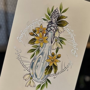 May include: A hand-drawn illustration of a glass bottle with a silver stopper, surrounded by yellow and white flowers. The bottle is decorated with a silver inscription that reads "One Ring to rule them all, One Ring to find them, One Ring to bring them all and in the darkness bind them."